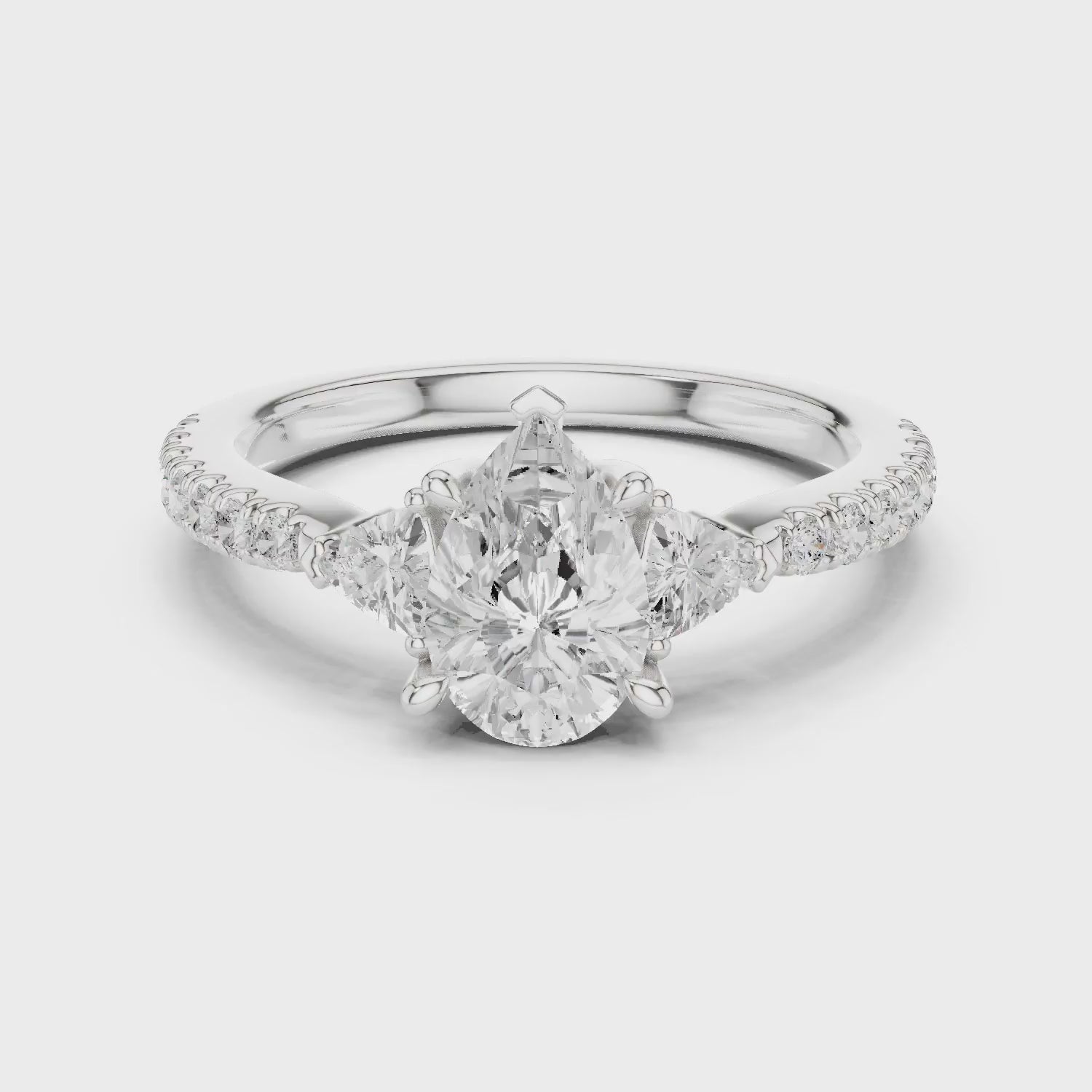 Pear Cut Diamond Three-Stone Engagement Ring with Pave Band