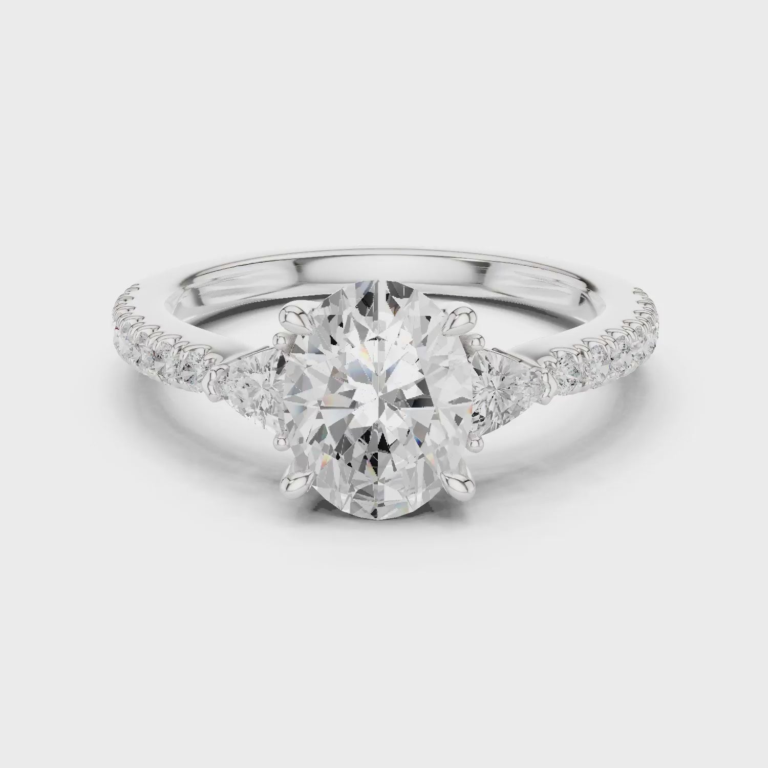 Oval Cut Diamond Three-Stone Engagement Ring with Pave Band