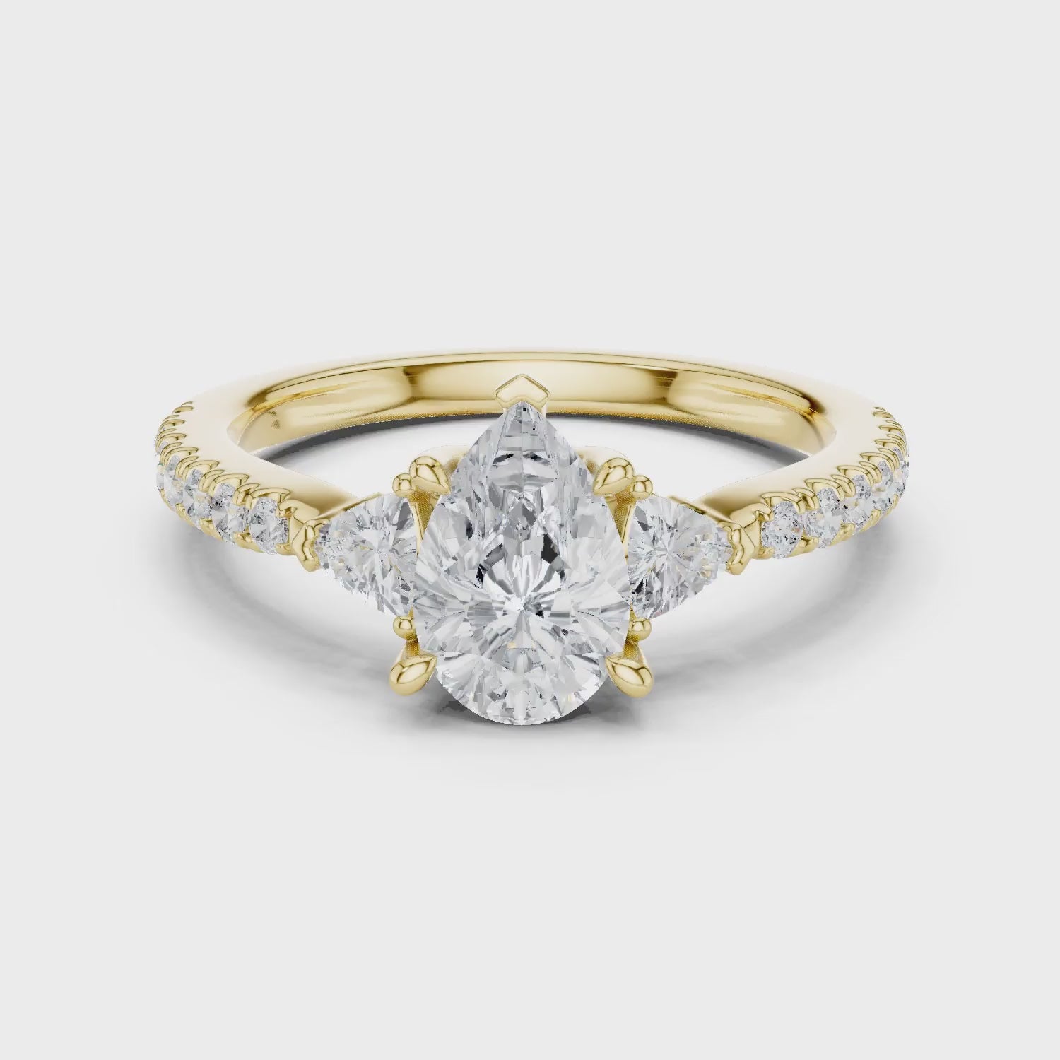 Pear Cut Diamond Three-Stone Engagement Ring with Pave Band