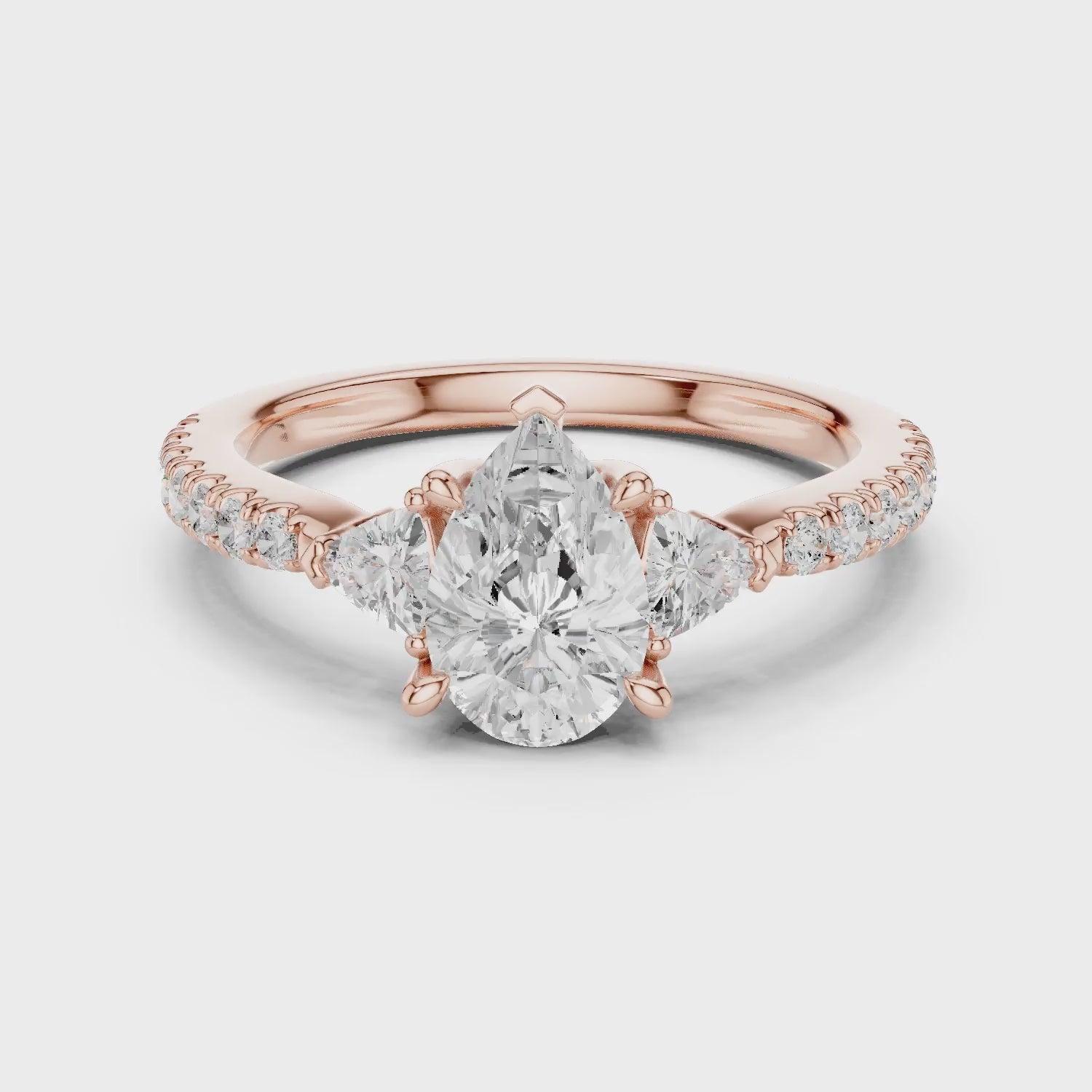 Pear Cut Diamond Three-Stone Engagement Ring with Pave Band